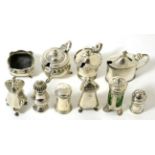 Three silver mustard pots, a pair of pepper casters, four various caster and a salt