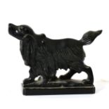 A carved model of a dog, possibly cannel coal or jet