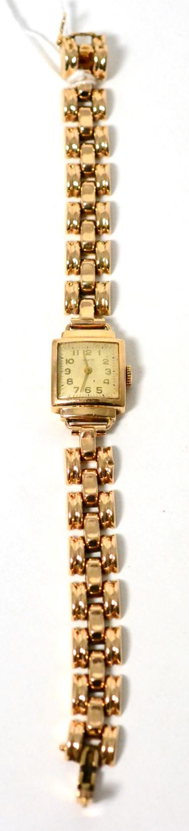 A Russian 14ct gold wristwatch on an integral bracelet strap