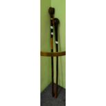 African hardwood knobkerrie and a hardwood walking stick with carved figured head