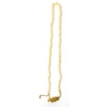 A cultured pearl necklace, a single strand of graduated cultured pearls, knotted to a barrel