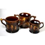 Three ''Rockingham'' treacle glazed frog mugs