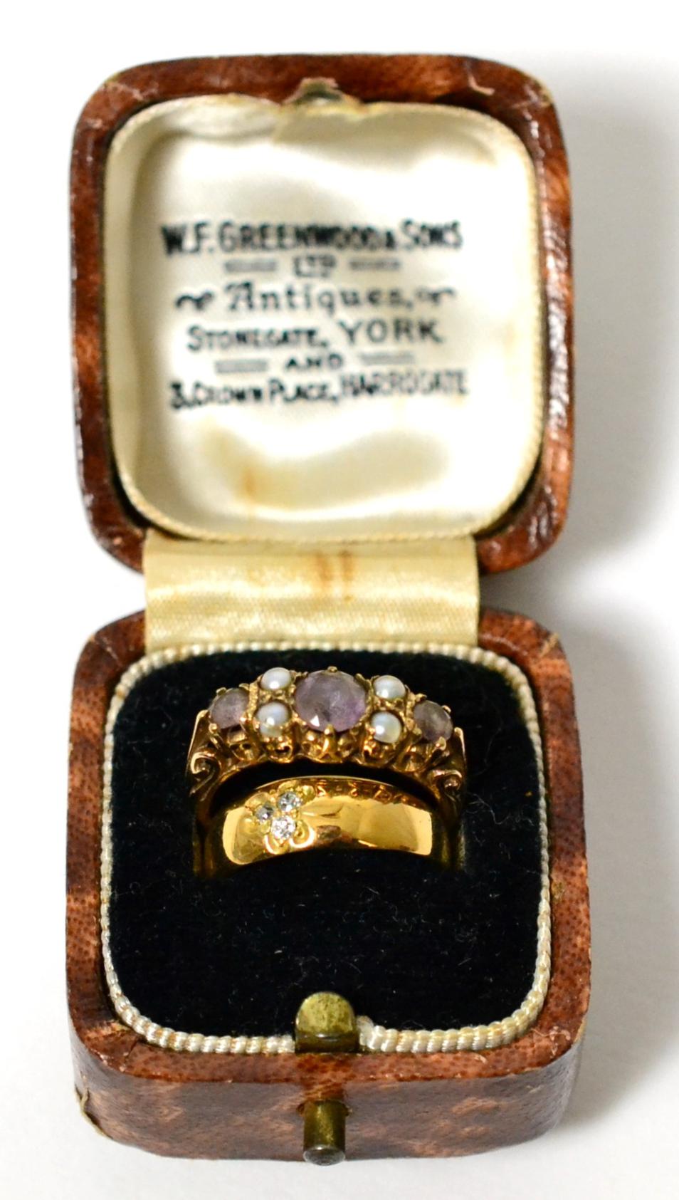 A diamond set cluster ring stamped '18ct' and a 9 carat gold amethyst and seed pearl ring (2)Diamond