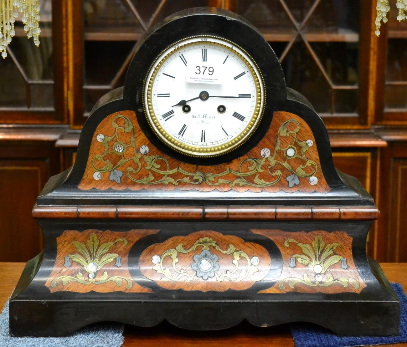 A French brass inlaid striking mantel clock, dial signed Hry Marc a Paris