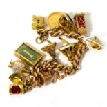 A 9ct gold charm bracelet, set with thirteen charms including a 1907 half sovereign and three seal