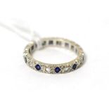 A sapphire and diamond eternity ring, stamped '18CT', finger size M3.6g gross