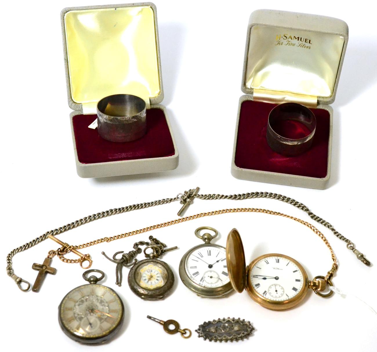 Three various silver watches, a gold plated pocket watch and two silver napkin rings etc (8)