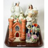 A group of Staffordshire flat back castles and figures