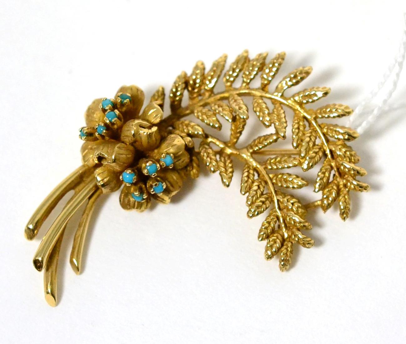 A turquoise set floral spray brooch, measures 5.5cm by 4cm, stamped '14K'15.8g gross