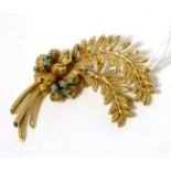 A turquoise set floral spray brooch, measures 5.5cm by 4cm, stamped '14K'15.8g gross