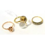 A rock crystal ring, stamped '750', a Russian beaded ring, stamped '583' and a 9 carat gold
