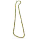 A faceted blue bead and yellow bead necklace, stamped '750', 42cm long 21.4g gross