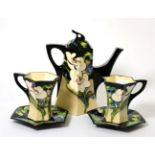 A Moorcroft teapot ''Au lait'' pattern (first) together with two matching cups and saucers (seconds)