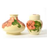 Walter Moorcroft coral Hibiscus vase and ginger jar and cover, on a white ground (2)