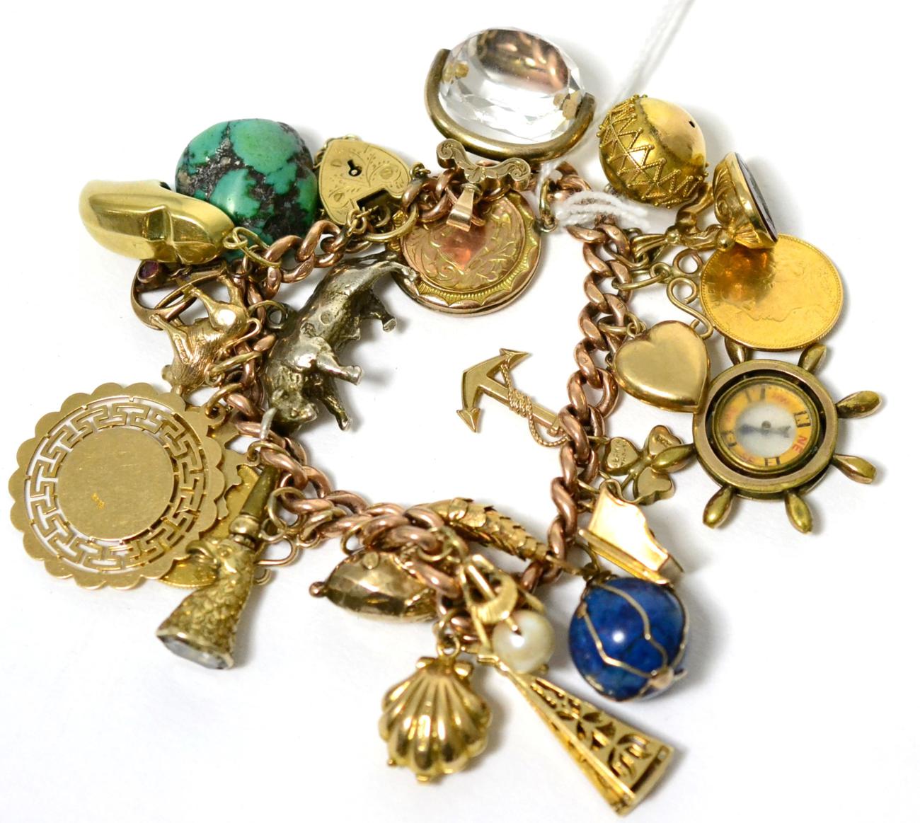 A charm bracelet with a 9 carat gold padlock, a soldered half sovereign, a 9 carat gold charm and