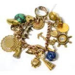 A charm bracelet with a 9 carat gold padlock, a soldered half sovereign, a 9 carat gold charm and