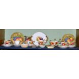 A fruit painted porcelain tea service by Richard Budd; together with a pair of fruit painted