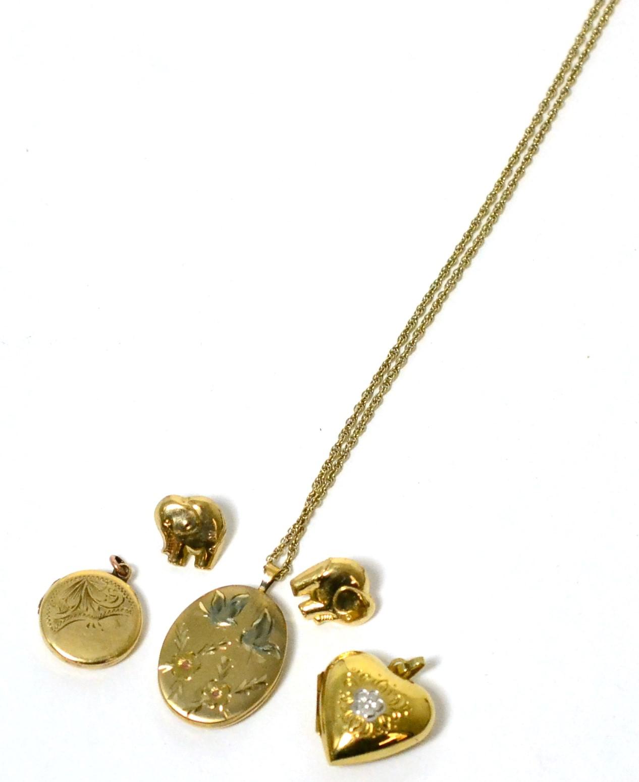 A 9 carat gold heart shaped locket pendant, on oval locket pendant, stamped '14CT', on chain,