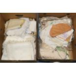 A quantity of assorted white linen and embroidered textiles etc (two boxes)