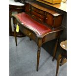 A reproduction mahogany writing table with super structure back, leather writing surface above two