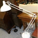 An oversized anglepoise floor lamp and a similar lamp