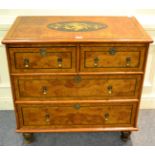 A 17th century style burr walnut and marquetry inlaid four drawer chest