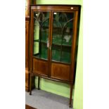 An inlaid mahogany display cabinet