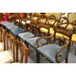 Set of seven mahogany dining chairs including one carver, with blue upholstered seats