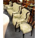 An early 20th century mahogany salon suite, including two canape and various chairs (9)