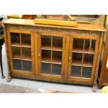 A reproduction oak dwarf bookcase