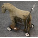 Toy horse on wheels