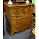 An early 19th century mahogany bow front chest of drawers