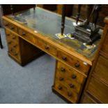 A Victorian walnut twin pedestal desk