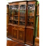 An inlaid mahogany breakfront astragal glazed bookcase cabinet