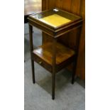 A 19th century mahogany single drawer wash stand with cabinet top