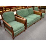 An Edwardian mahogany framed three piece Bergere suite