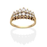 A Diamond Ring, two rows of graduated round brilliant cut diamonds in claw settings to split