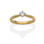 An 18 Carat Gold Diamond Solitaire Ring, a round brilliant cut diamond in a claw setting, to knife