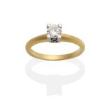 An 18 Carat Gold Diamond Solitaire Ring, a round brilliant cut diamond in a claw setting,