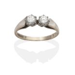 An 18 Carat White Gold Diamond Two Stone Ring, round brilliant cut diamonds in claw settings, to