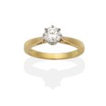 An 18 Carat Gold Diamond Solitaire Ring, a round brilliant cut diamond in a white claw setting, to