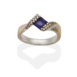 An 18 Carat White Gold Iolite and Diamond Twist Ring, a square cut iolite in a pavé set diamond