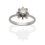 A Diamond Solitaire Ring, a round brilliant cut diamond in a raised claw setting, to knife edge