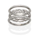 An 18 Carat White Gold Triple Band Eternity Ring, three seperate bands comprising a central