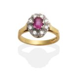 An 18 Carat Gold Pink Sapphire and Diamond Cluster Ring, an oval cut pink sapphire within a border