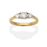 An 18 Carat Gold Diamond Three Stone Ring, graduated round brilliant cut diamonds in claw