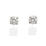 A Pair of 18 Carat White Gold Diamond Solitaire Earrings, a round brilliant cut diamond in a claw