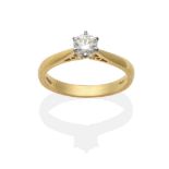 An 18 Carat Gold Diamond Solitaire Ring, a round brilliant cut diamond in a claw setting, to knife
