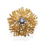 An 18 Carat Gold Diamond and Sapphire Brooch, a round brilliant cut diamond within a cluster of