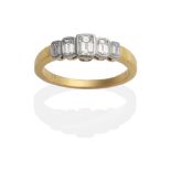 An 18 Carat Gold Diamond Five Stone Ring, octagonal cut diamonds in rubbed over settings, on a